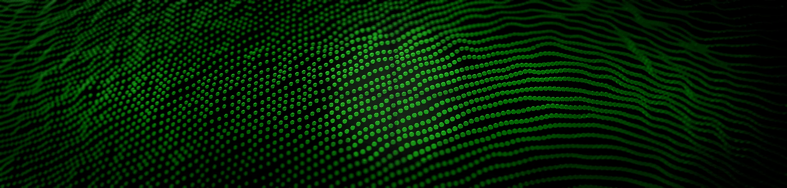 Green filed of dots with reed logo